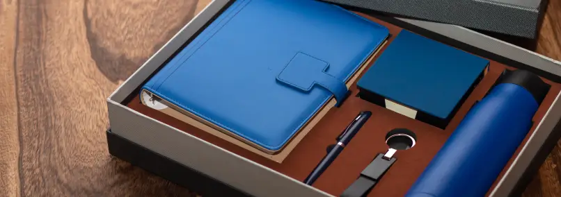 Gift box with a notebook, pen, water bottle, and notepad.