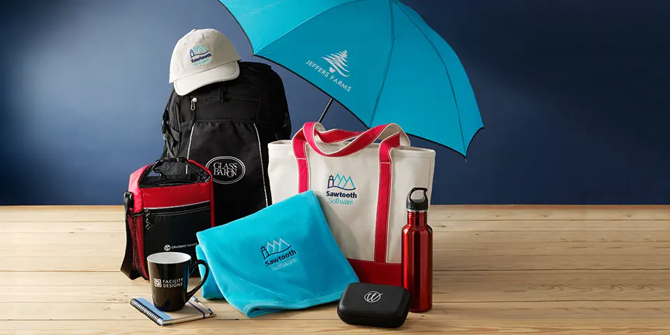 Two sailboats pass by a lighthouse on the coast.