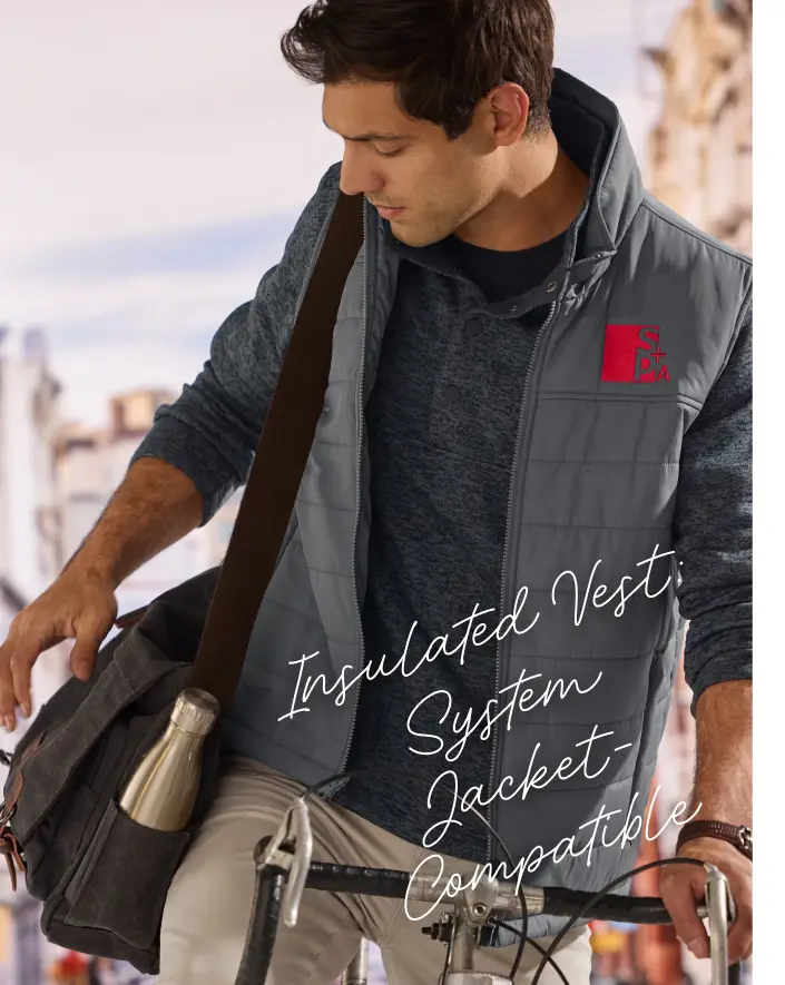 Insulated Vest System Jacket-Compatible. A man wearing a grey vest.