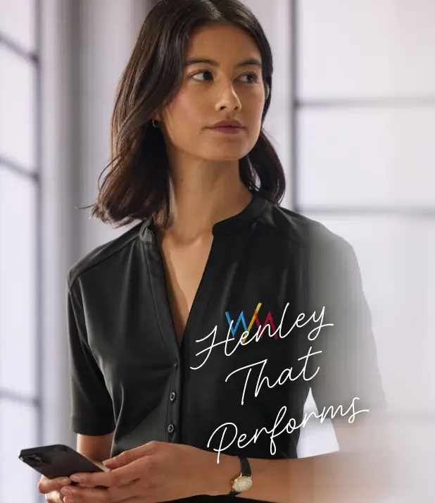 A woman wearing a black henley.