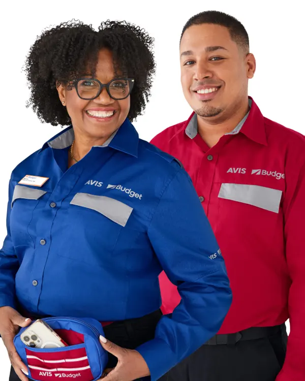 Two employees posing in red and blue button down shirts.