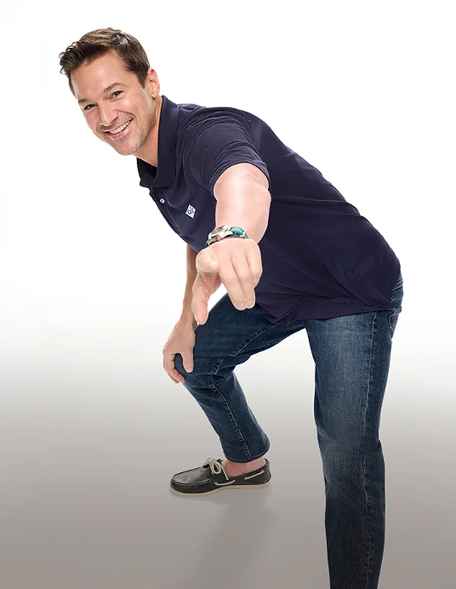 Man wearing a navy flexpique polo.