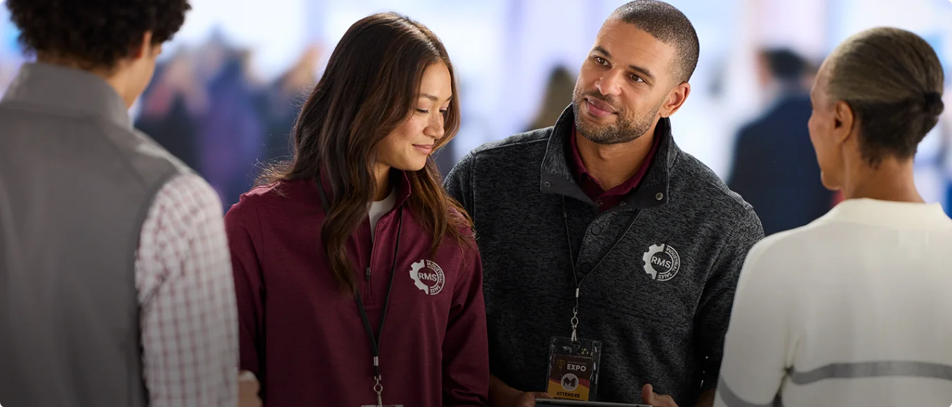 Woman wearing a fleece pullover and man wearing a fleece jacket.