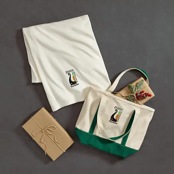 Gift set of a tote, towel and fleece blanket.