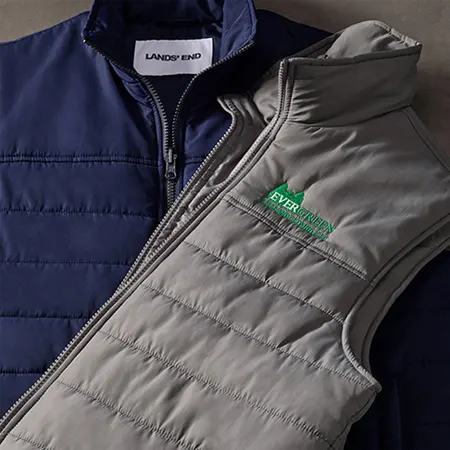 A navy insulated jacket and a gray insulated vest.
