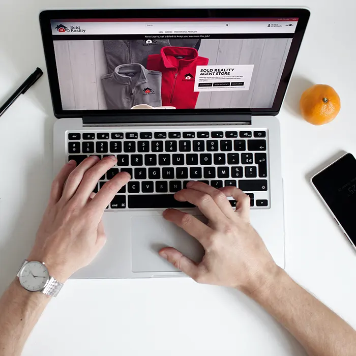 A laptop with a Lands' End Business custum online store displayed.
