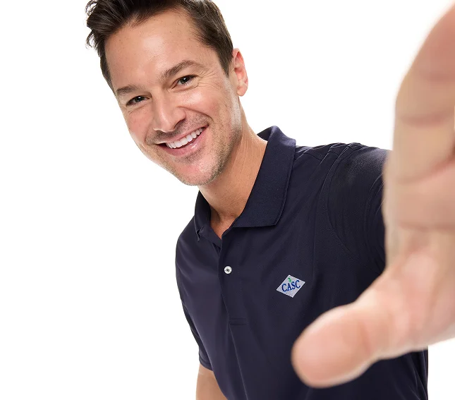Man wearing a navy flexpique polo.