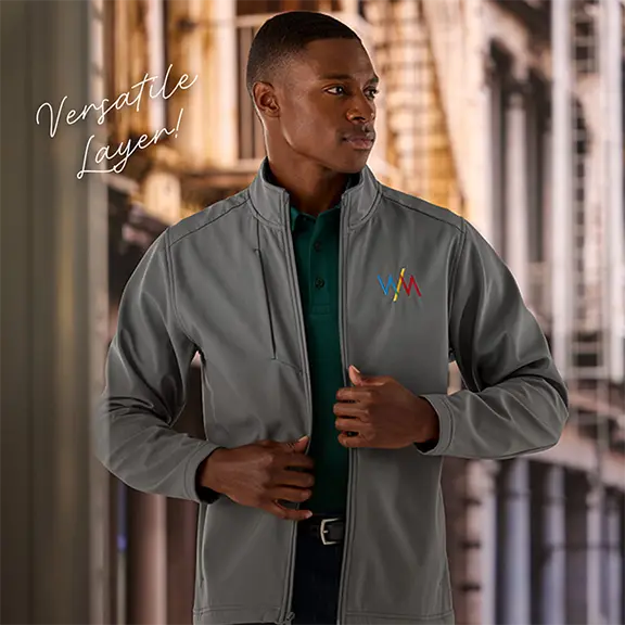 Versatile Layer! A man wearing a gray soft shell jacket.