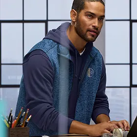 A man wearing a fleece vest.