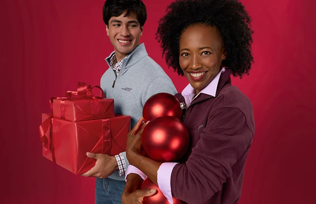 People wearing custom uniforms and holding red holiday gifts