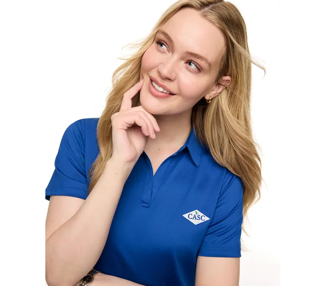 Woman wearing a blue rapid dry polo.