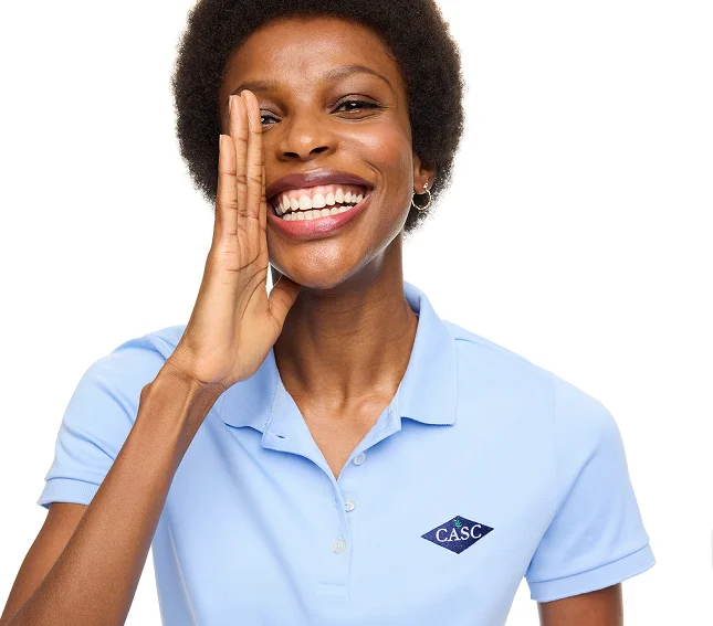 Woman wearing a blue signature supima polo.