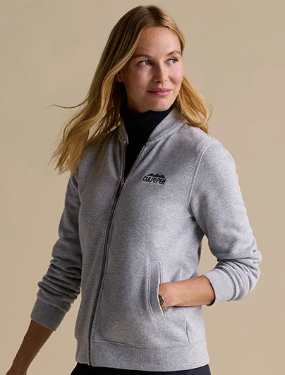 Woman wearing a gray Bedford French rib full zip jacket