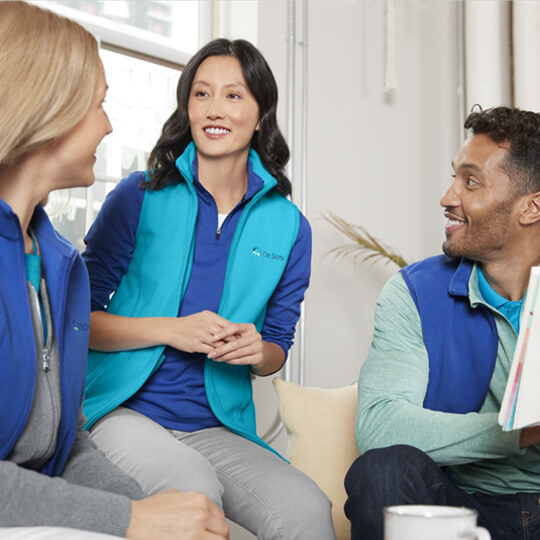 Several employees planning a project together.