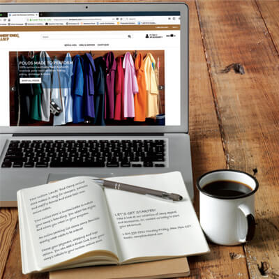 A laptop with a Lands’ End Business uniform program open on it.