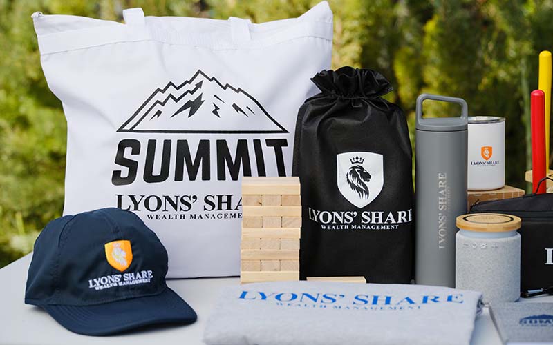 A spread of various clothes and promotional products that have had a logo applied to them.